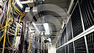 Inside room with data centers and cables. Stock footage. Room with data centers, cables and solar panels to absorb