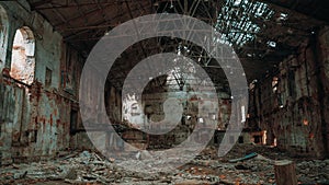 Inside ruined and abandoned large creepy industrial factory warehouse hangar