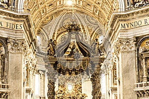 INSIDE SAINT PETER BASILICA WIT BALDACHIN ALTAR. FAMOUS DESTINATION OF ROME.