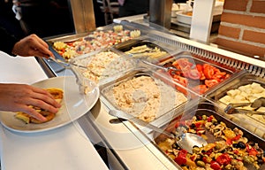 self service restaurant with many raw and cooked foods photo