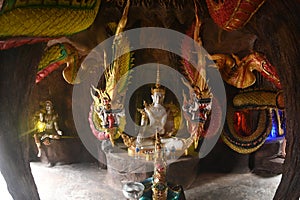 Inside Serpent Cave There are statues of sitting buddha and serpents.