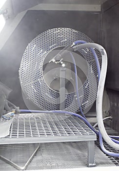 Inside Shot blasting machine. Machine for Shot blasting of objects. Industrial