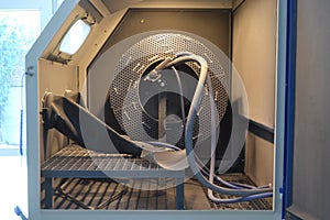 Inside Shot blasting machine. Machine for Shot blasting of objects. Industrial