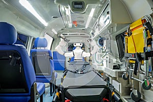 Inside smart ambulance car with medical equipment and smart robot assistant