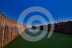 Inside the soo locks in Sault ste marie michigan waiting for the water to rise to superiors depth