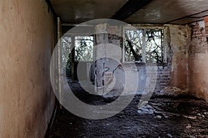 Inside a spooky eerie ruined abandoned house. With broken windows and doors in the countryside