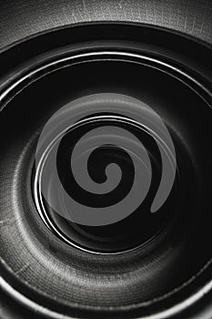 Inside of stacked car tires, abstract black background