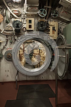 Inside submarine opened round hatch