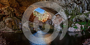 Inside Tonto Natural Bridge Panorama with a Waterfall