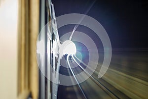 Inside tunel blur abstract scene traveling by train looking forward