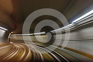 Inside tunel blur abstract scene traveling by train looking forward photo