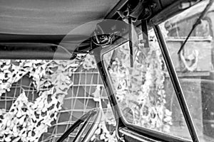 Inside a US Army WW2 jeep seen next to a field tent.