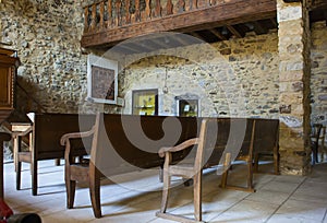 The inside of a very small ancient stone built Catholic museum Church in the historic village of Le Poet Laval in France