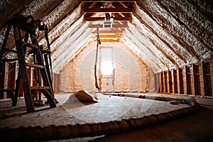 Inside view of an attic covered with spray foam