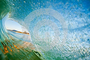 Inside view of a barreling wave at Campeche beach in Florianopolis Brazil