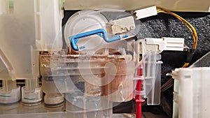 Inside view of an calcified dish washing machine