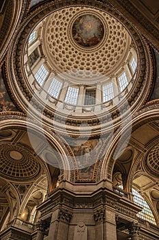 Inside view of the colorful and richly decorated Pantheon dome and ceiling in Paris.