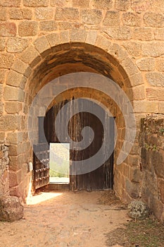 Inside view of the main door of an old stone castle.