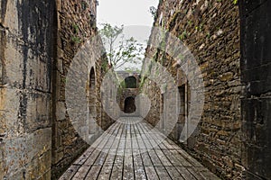 Inside view of an old monastery, made of stone and without a roof.