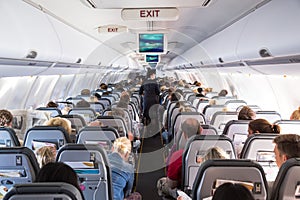 Inside view on passenger and cabin crew people on an airline airplane during flight  vacation. Transportation tourism aviation