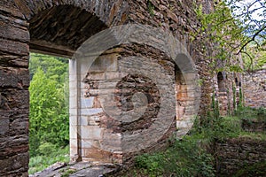 Inside view of an old monastery, made of stone and without a roof. photo