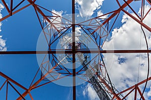 Inside view of telecommunication tower with microwave, radio panel antennas, outdoor remote radio units, power cables