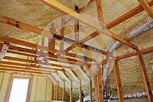 Inside wall insulation in wooden house, building under construction