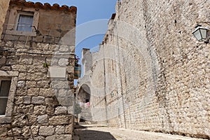 Inside wall of medieval city high wall leads to steps