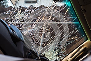 Inside windshield cracks.