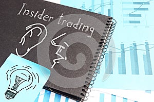 Insider trading is shown on the business photo using the text