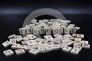 Insolvenz - symbolic letters - German language - dark background