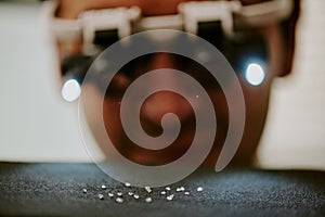 Inspecting Jewelry with Magnifying Eye Loupe Device photo