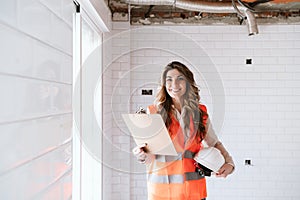 Inspector or architect professional woman checking kitchen at construction site. Home improvement