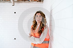 Inspector or architect professional woman checking kitchen at construction site. Home improvement