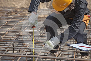 Inspector checks the construction parameters of foundation