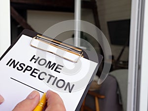 Inspector fills out the Home inspection form.