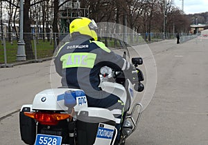 The inspector of the road police patrol on the service motorcycle controls the road.