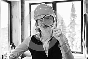 Inspector woman using a magnifying glass