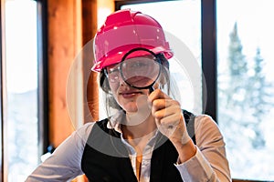 Inspector woman using a magnifying glass