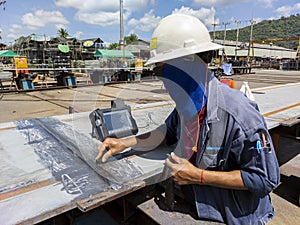 The inspectors are checking defect in welded of steel add joint with process Ultrasonic testing UT of Non-Destructive Testing