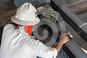 Inspectors are checking defect in welded with process Ultrasonic testing UT photo