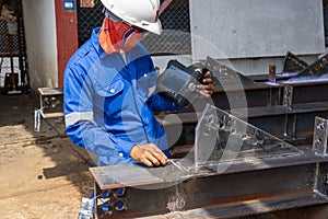 Inspectors are checking defects in welded steel h-beam add joint with process Ultrasonic testing & x28;UT& x29;