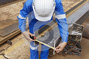 Inspectors use a Measuring Tape to Check the Steel Structures Accuracy after Assembly and Welding