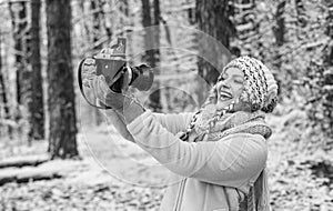 Inspiration create something special. Spend day outdoors. Girl with vintage camera in snowy nature. Traveling concept