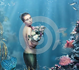 Inspiration. Fantastic Woman with Flowers in Water