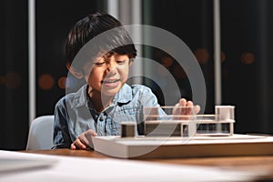 Inspiration kids in occupation, Asian kid smile and enjoy to playing to home model box in the job of parent at office room at