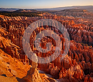 Inspiration Point during beautiful sunrise, with hoodoos - unique rock formations from sandstone made by geological erosion Bryce
