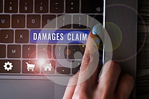 Inspiration showing sign Damages Claim. Business approach Demand Compensation Litigate Insurance File Suit photo