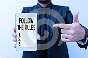 Inspiration showing sign Follow The Rules. Business concept go with regulations governing conduct or procedure