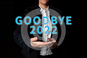 Hand writing sign Goodbye 2022. Business approach New Year Eve Milestone Last Month Celebration Transition photo